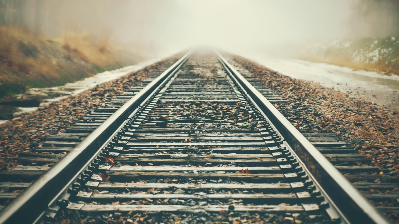 Train track in the fog