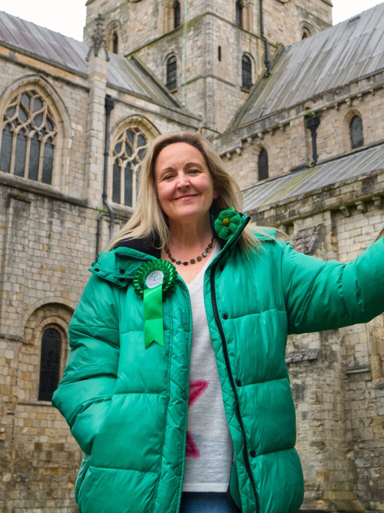 Angela Oldershaw standing outside Selby Abbey